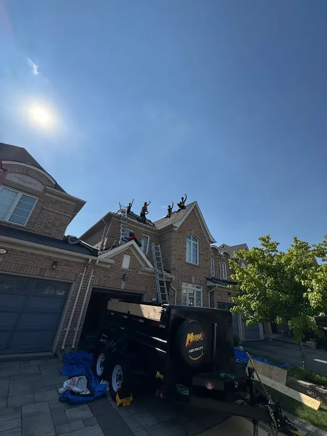 Roofing crew on a completed rooftop